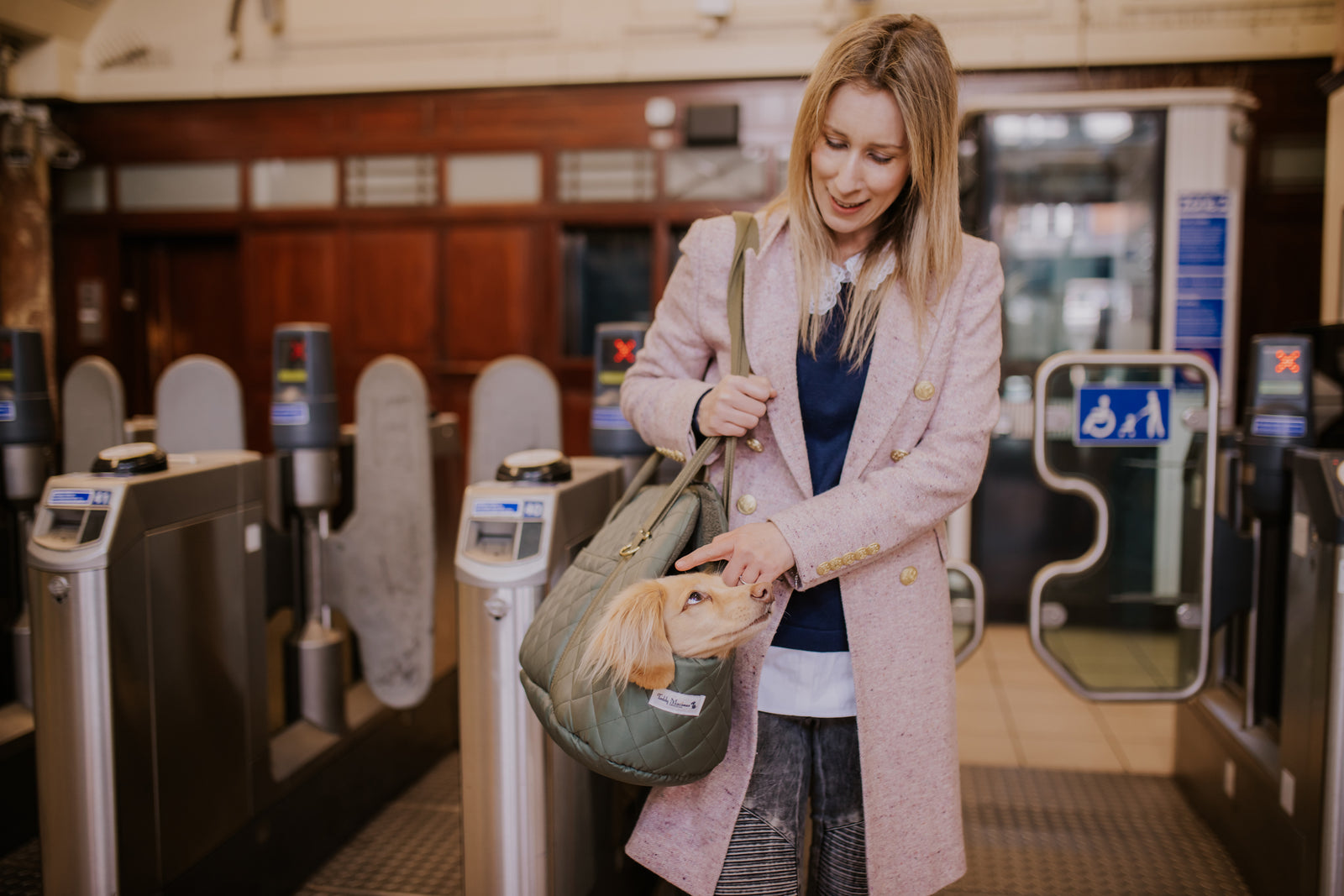 Holly carrying Teddy in a dog carrier